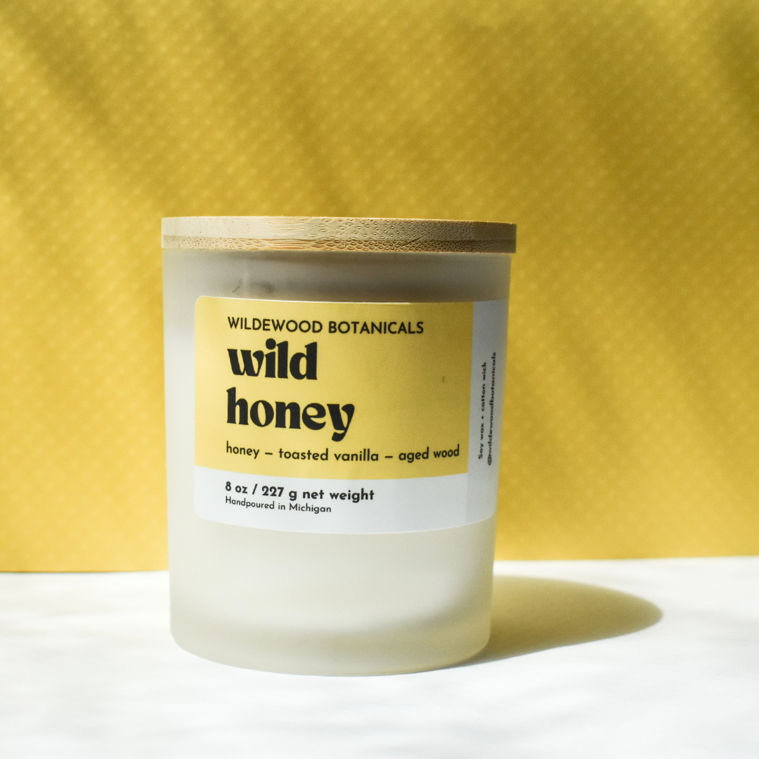 regular sized wild honey soy candle on yellow and white background