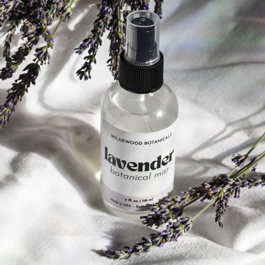 Honeyed Lavender Botanical Mist - 4 oz. on white background with lavender